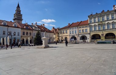 Historical european Bielsko-Biala city and tower of St. Nicholas cathedral in Poland, clear blue sky in 2022 warm sunny spring day on April.