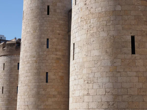 Stony walls of palace in european Saragossa city at Aragon district in Spain, clear blue sky in 2019 warm sunny summer day on September.