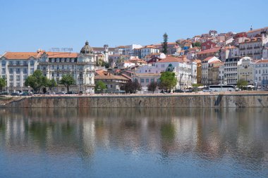Panoramic Coimbra city with Mondego river at central district in Portugal, clear blue sky in 2022 warm sunny spring day on May.