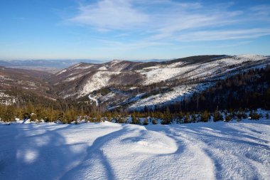 Beauty Silesian Beskid Mountains range on european Bialy Krzyz in Poland, clear blue sky in 2022 cold sunny winter day on February.