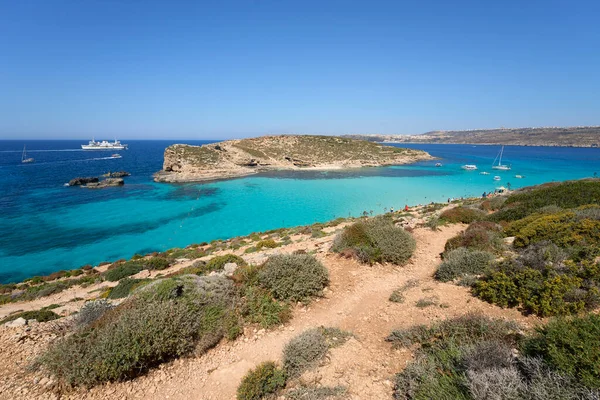 COMINO, MALTA on MAY 2022: Landscape of blue lagoon on european island, clear blue sky in warm sunny spring day.
