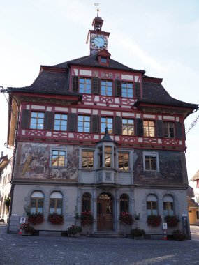 Town hall in european Stein am Rhein village in canton Schaffhausen in Switzerland, clear blue sky in 2018 warm sunny summer day on August - vertical