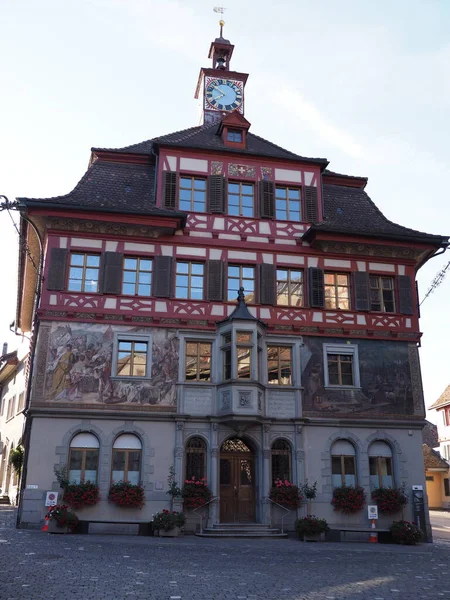 Town hall in european Stein am Rhein village in canton Schaffhausen in Switzerland, clear blue sky in 2018 warm sunny summer day on August - vertical