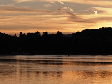Romantic sun set over Rhine River near european Stein am Rhein at canton Schaffhausen in Switzerland, cloudy sky in 2018 warm summer evening on August