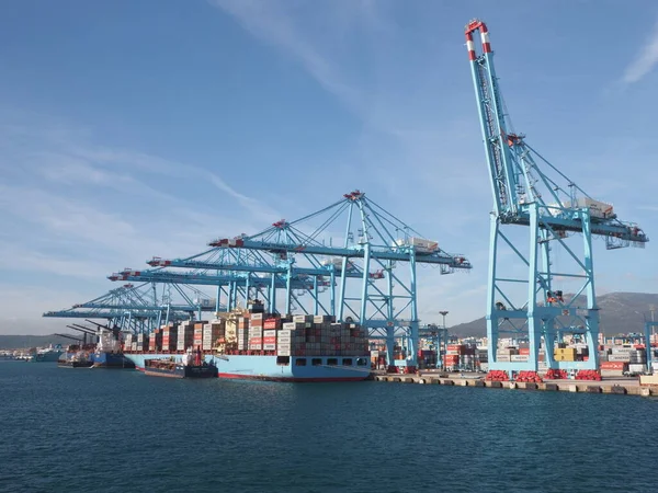 Containers in port of european Algeciras city in province of Cadiz in Spain, clear blue sky in 2019 warm sunny summer day on September.
