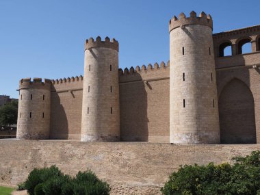 Towers of palace in european Saragossa city at Aragon district in Spain, clear blue sky in 2019 warm sunny summer day on September. clipart