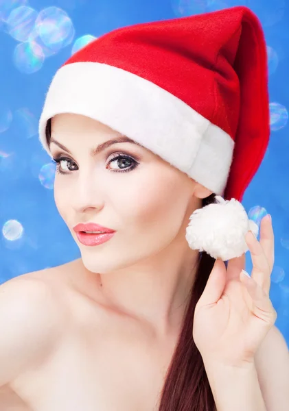 Atraktivní santa girl na slavnostní pozadí — Stock fotografie