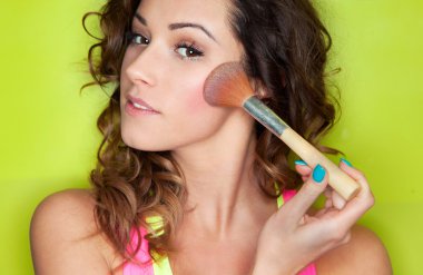 Woman with cosmetic brush clipart