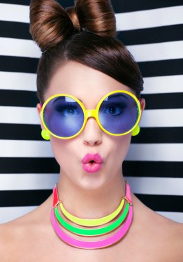 Surprised young woman wearing sunglasses