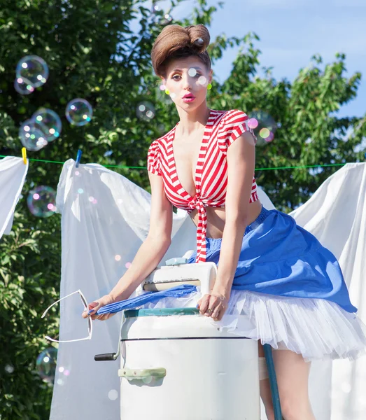 Woman with vintage wringer washing machine — Stock Photo, Image