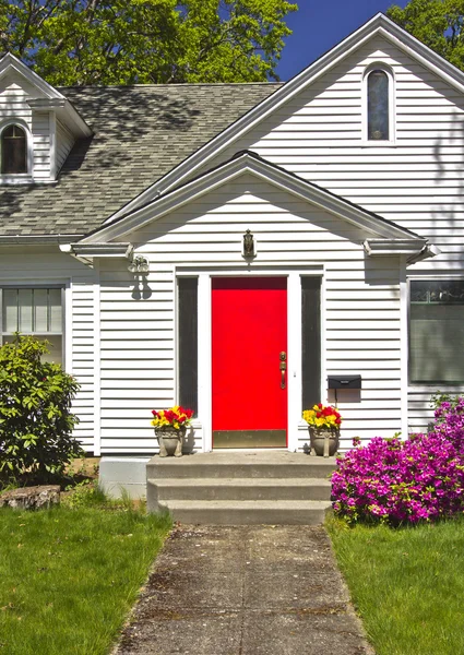 House with a red door.