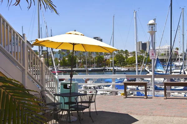 Yellow umbrella Long Beach marina. — Stock Photo, Image