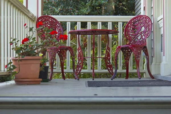 Two red chairs and a table. — Stock Photo, Image