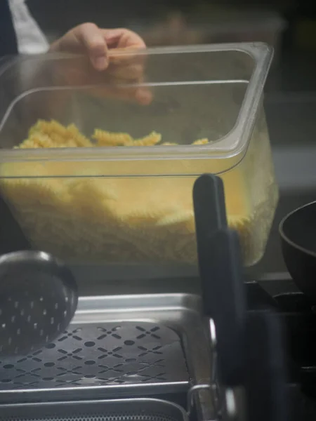 Pasta boiler in professional kitchen of restaurant