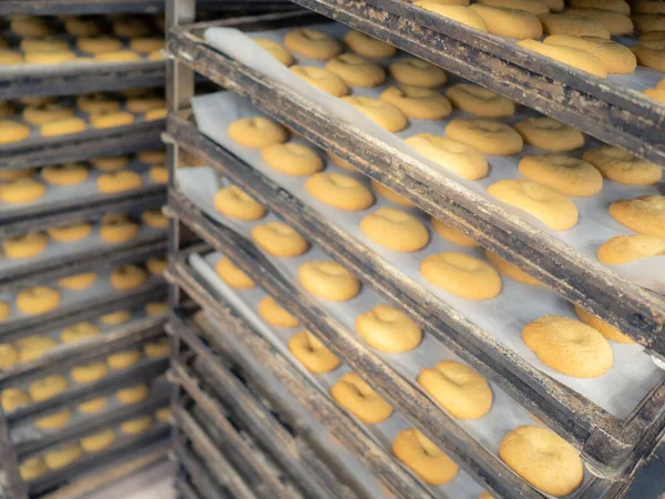 preparing sweet yellow cookies in the bakery