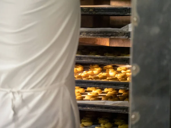 preparing sweet yellow cookies in the bakery