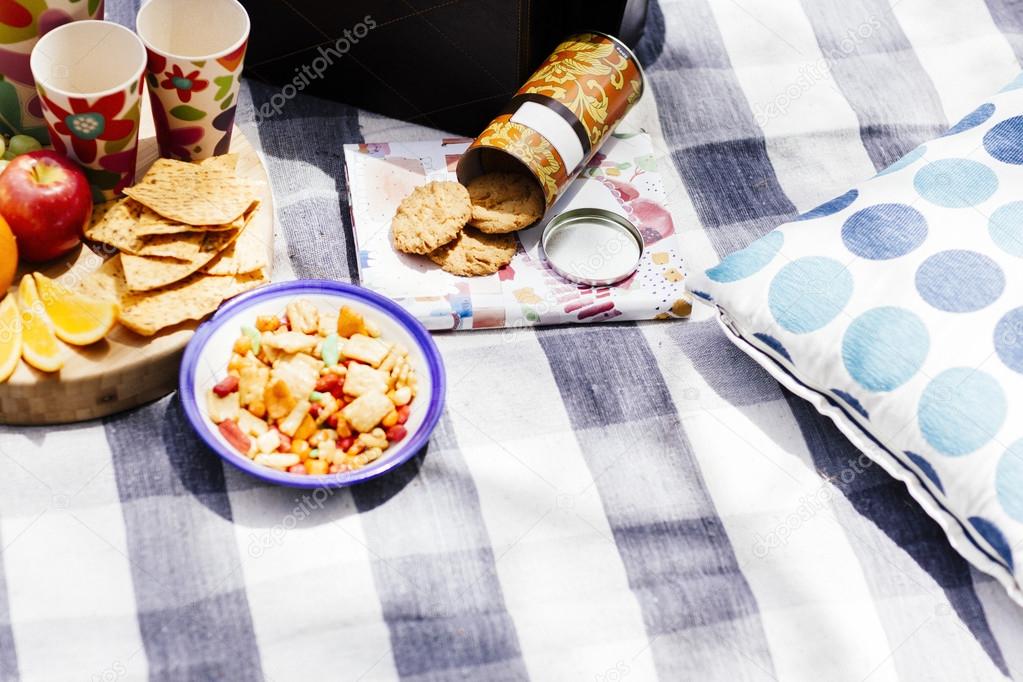 picnic setting with fresh fruit and snacks