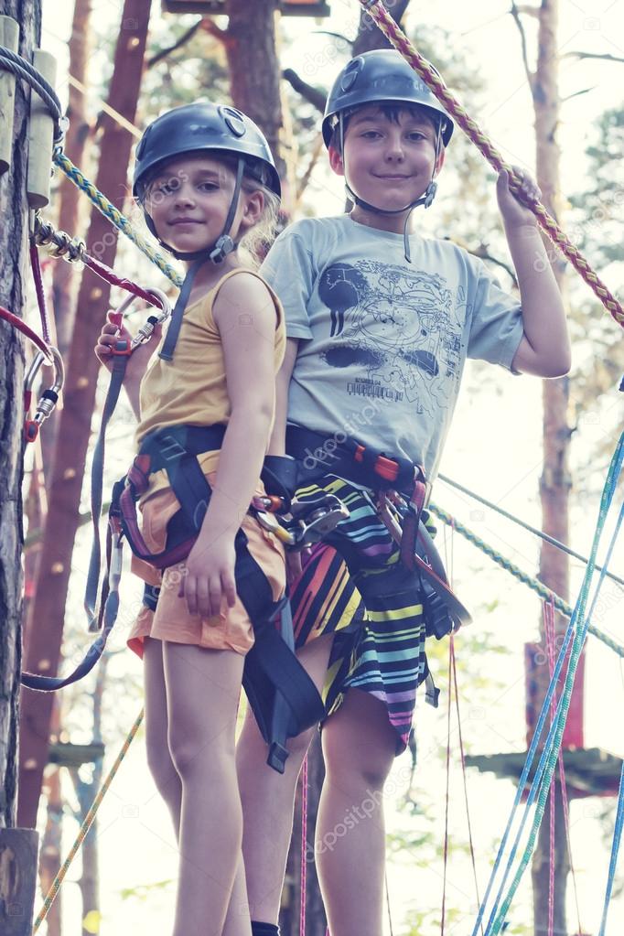 Girl and boy in adventure park