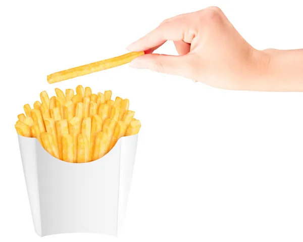 French fries in packaging with hand — Stock Photo, Image