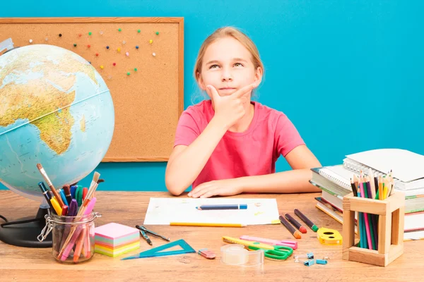 Young girl thinking about her homework — Stock Photo, Image