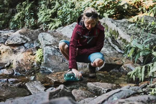 Woman Taking Pure Water Bottle Mountain Stream Trekking Mountains Hiker — Stock Photo, Image