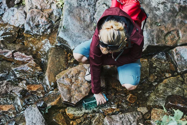 Woman Taking Pure Water Bottle Mountain Stream Trekking Mountains Hiker — Stock Photo, Image
