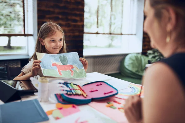 Girl Presenting Her Artwork Teacher Woman Assisting Schoolgirl Classes Primary — Stock Photo, Image