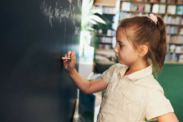 Little Girl Writing Blackboard Smart Student Put Solve Chalkboard Back — Stockfoto