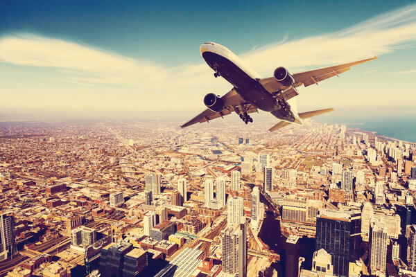 Business Travel. Airplane over the city
