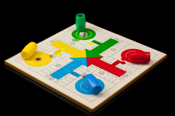 Parchis, tipical spanish game, isolated on black Stock Picture