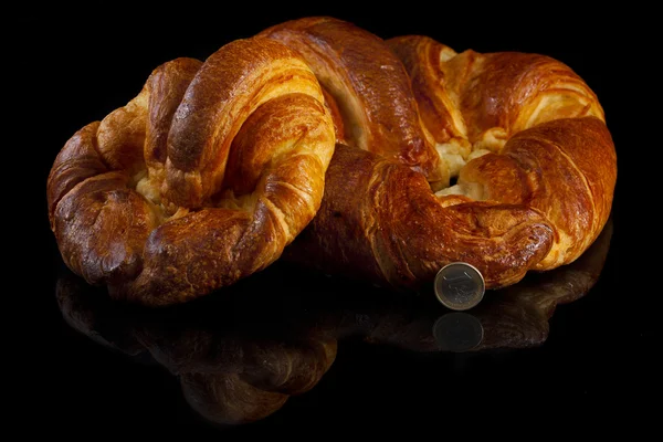 Gigant croissants, isolated on black — Stock Photo, Image