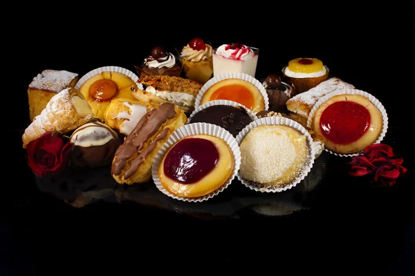 Little cakes, isolated on black Stock Image