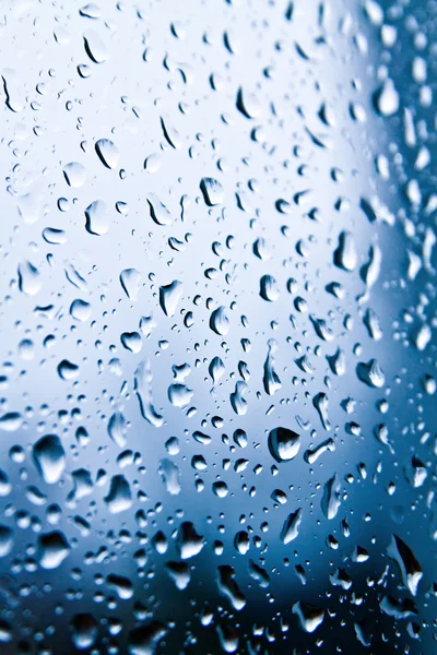 Raindrops on blue glass — Stock Photo, Image