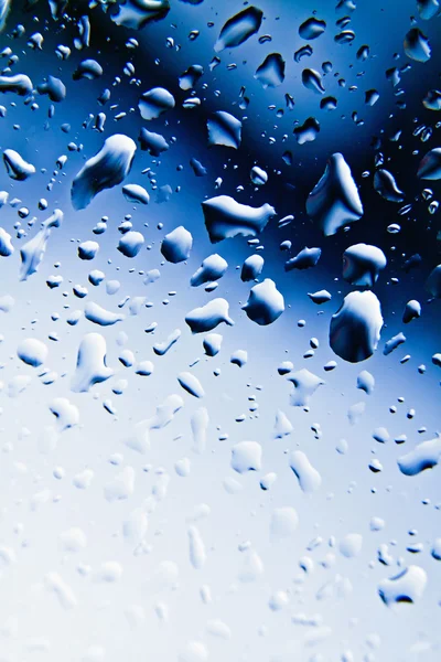 Raindrops on blue glass — Stock Photo, Image