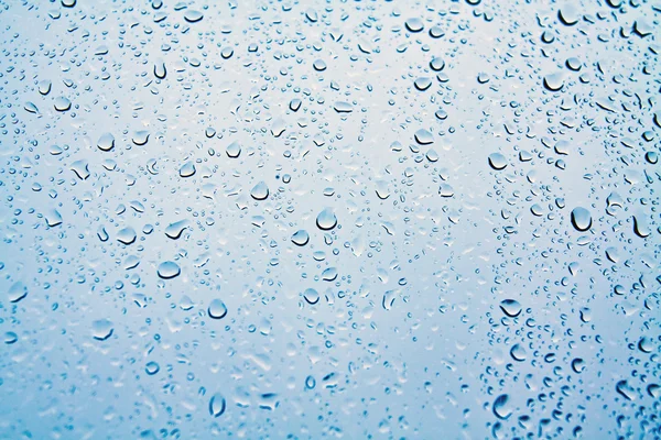 Raindrops on blue glass — Stock Photo, Image