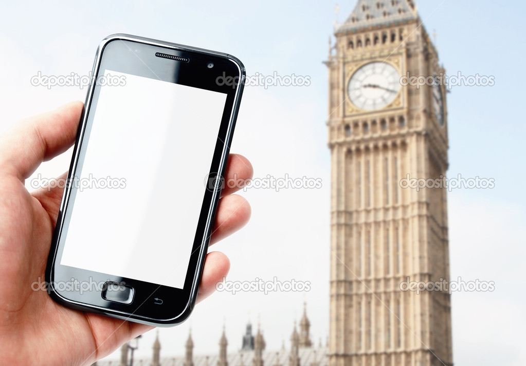 Hand holding smartphone with London city view