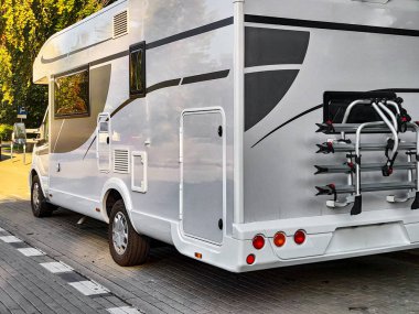 White caravan camper travel car on campsite