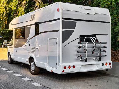 White caravan camper travel car on campsite