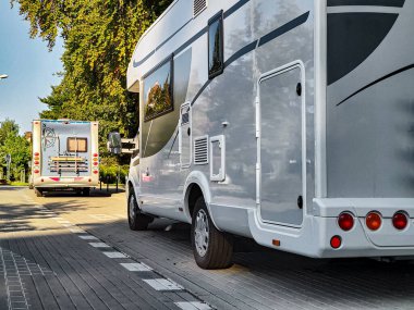 White caravan camper travel car on campsite