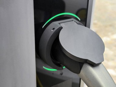 Eco electric car charging battery energy at power station