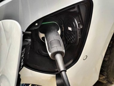 Eco electric car charging battery energy at power station