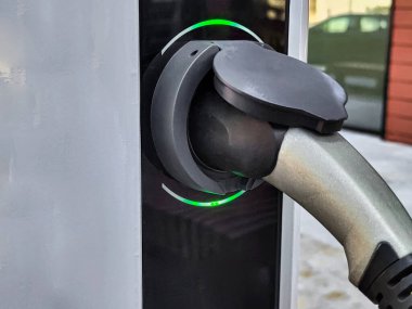 Eco electric car charging battery energy at power station