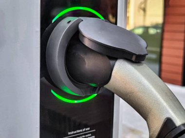Eco electric car charging battery energy at power station
