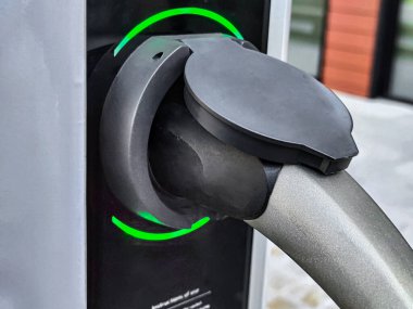 Eco electric car charging battery energy at power station