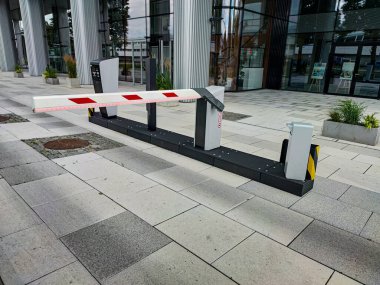 Underground garage parking entrance with boom barrier