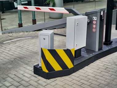Underground garage parking entrance with boom barrier