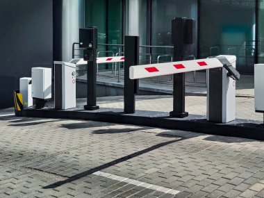 Underground garage parking entrance with boom barrier