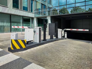 Underground garage parking entrance with boom barrier