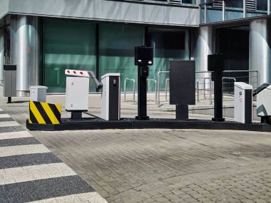 Underground garage parking entrance with boom barrier