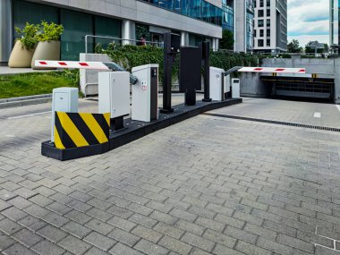 Underground garage parking entrance with boom barrier